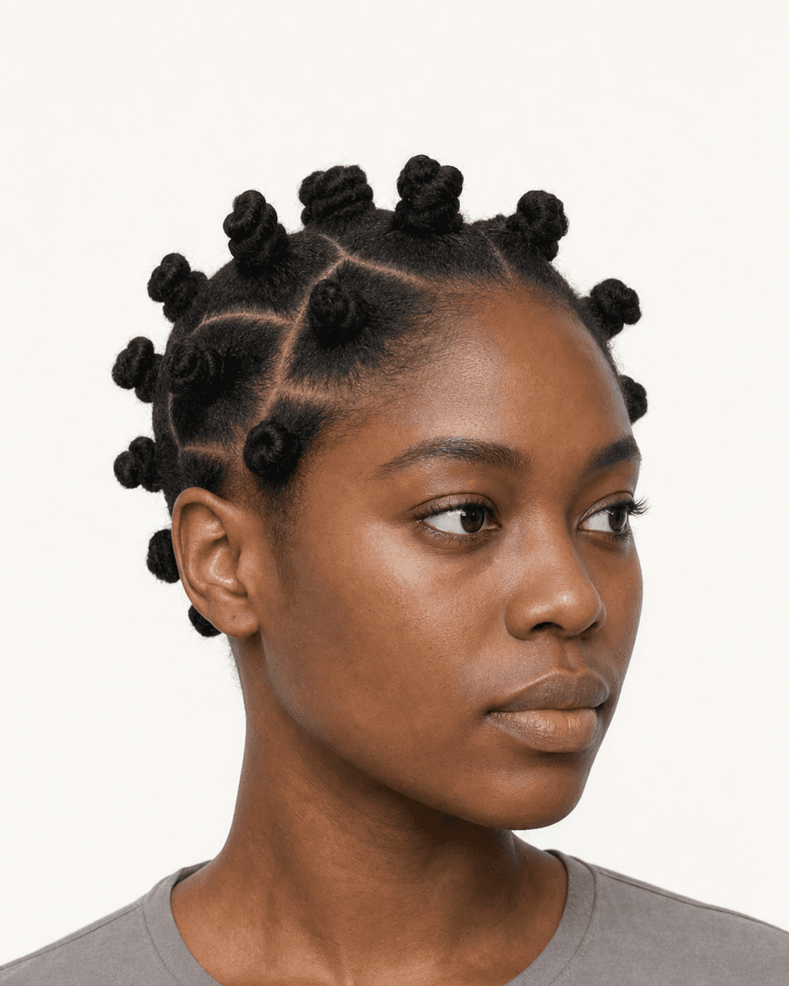 Three-quarter view of Bantu knots with clean parting