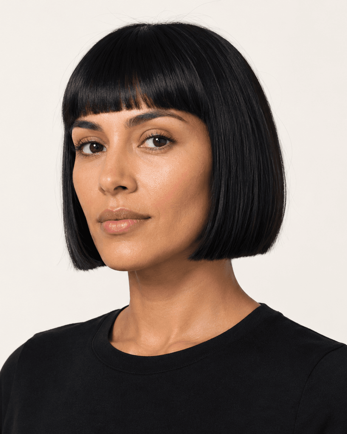 Three-quarter view of a blunt bob with micro fringe showing shape and finish