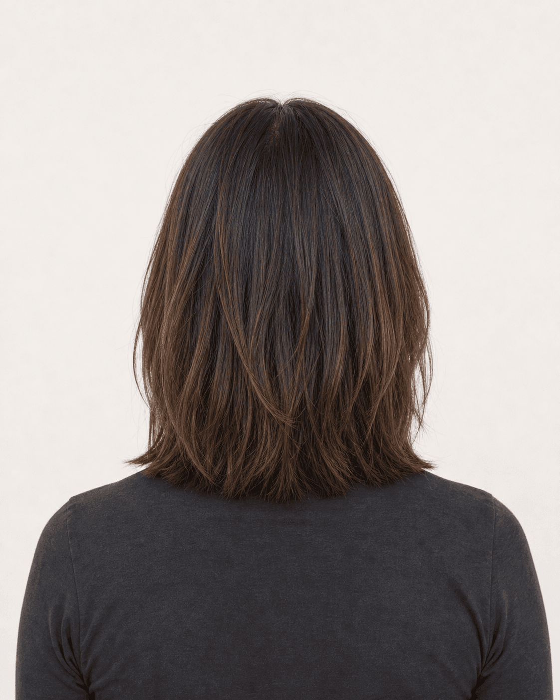 Rear view of a shoulder-length lob showing a softly shaped perimeter