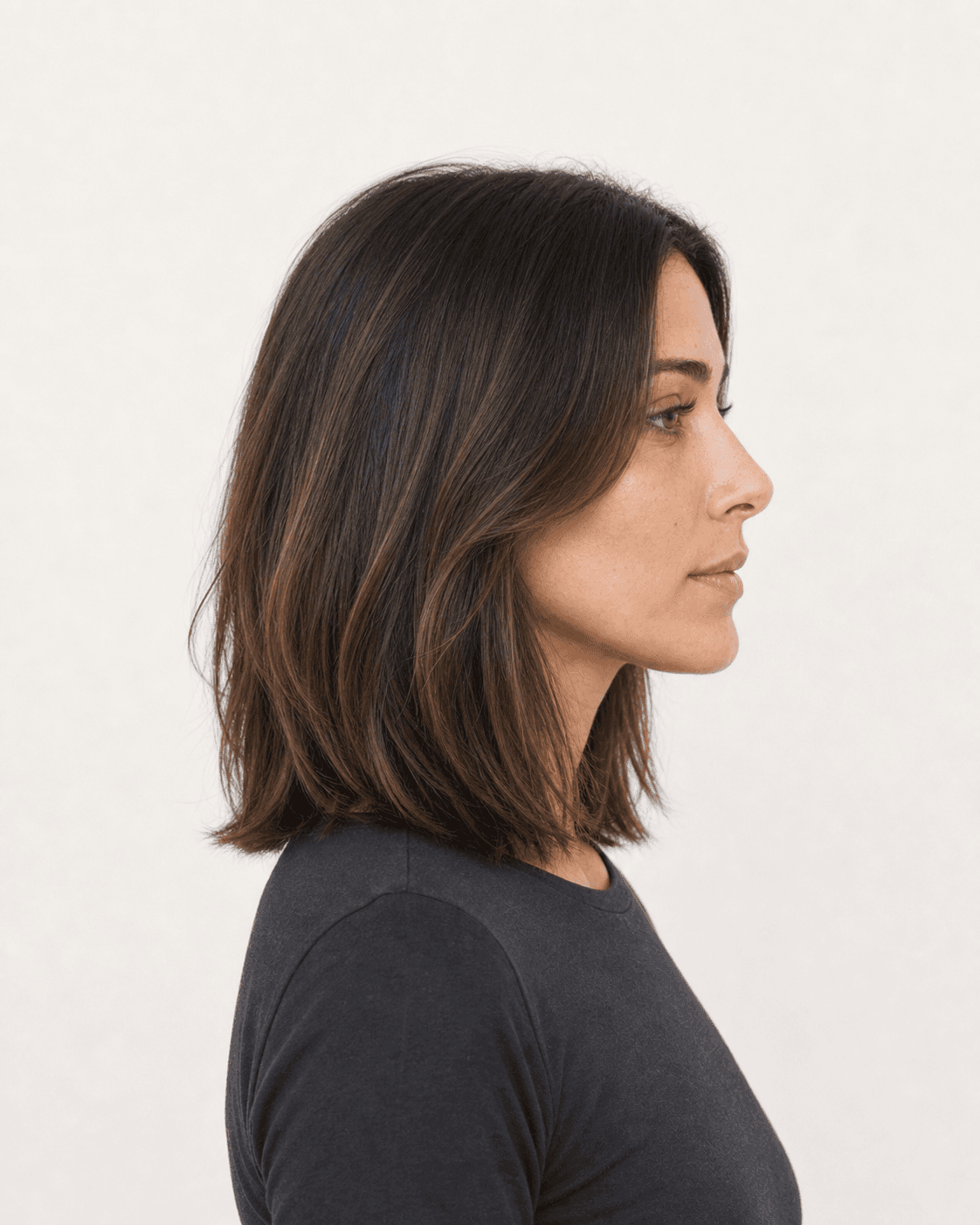 Side profile of a shoulder-length lob showing crown fall and invisible layering