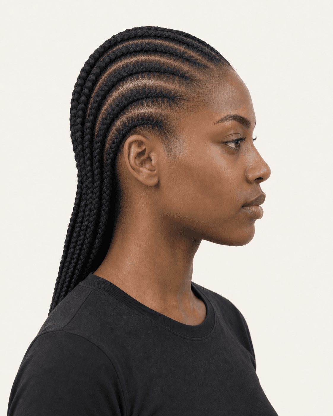 Side profile of straight-back feed-in cornrows showing parallel sections