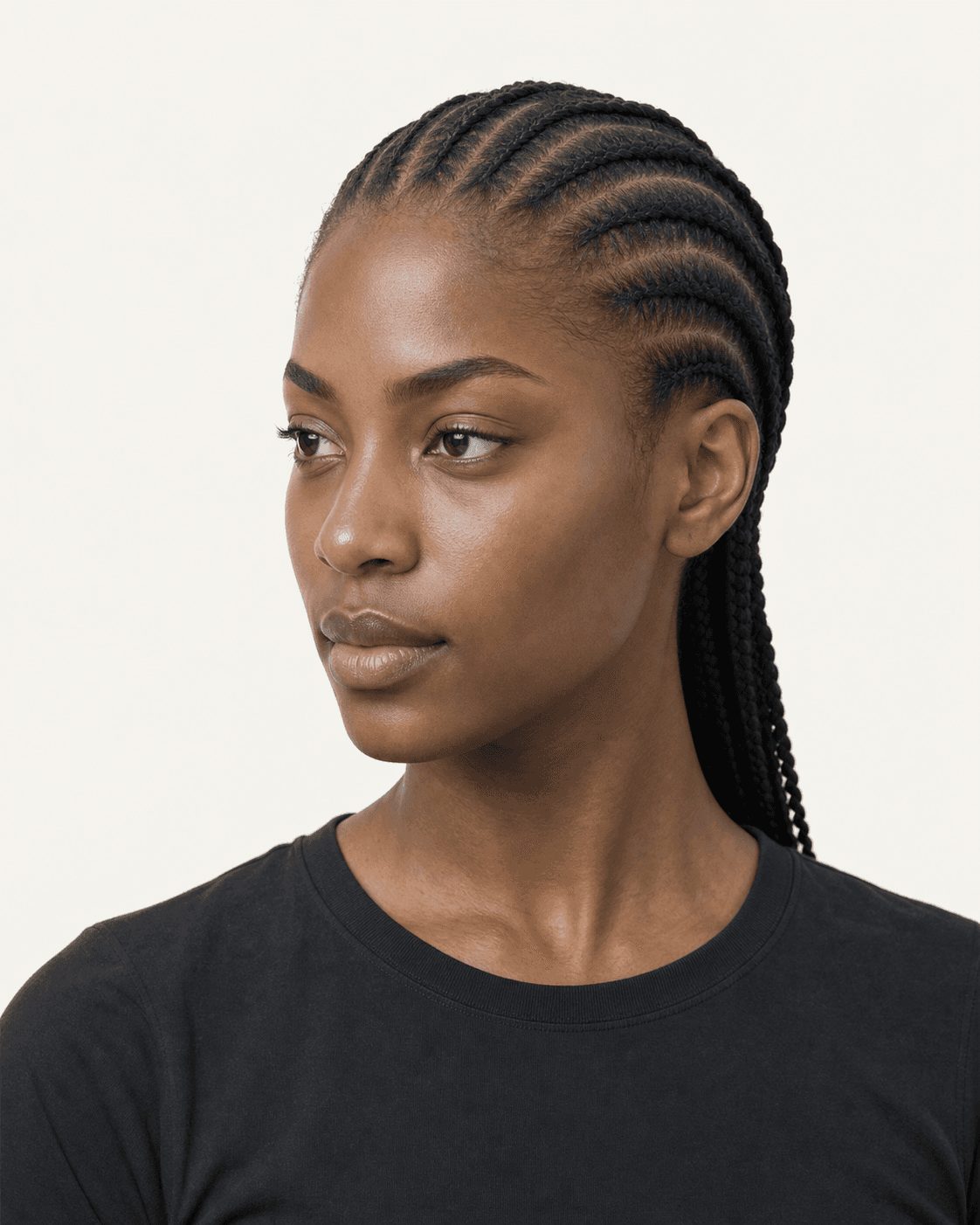 Three-quarter view of straight-back feed-in cornrows