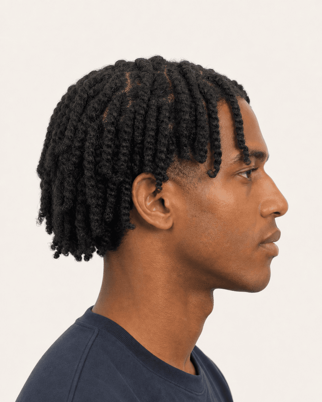 Side profile of two-strand twists showing full temple coverage and a low taper